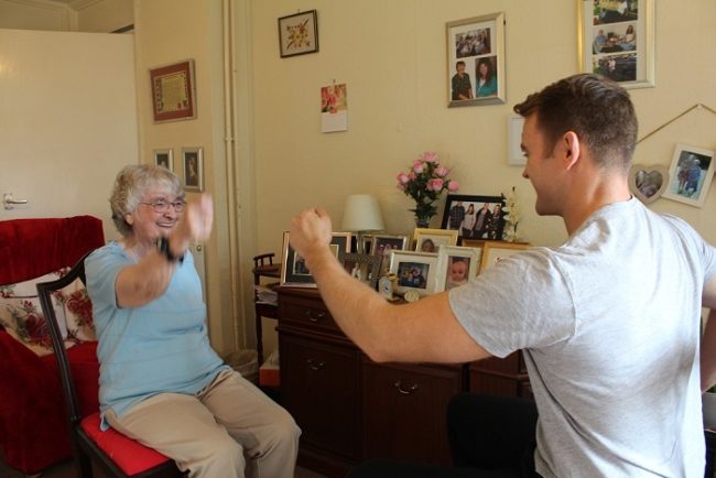 Lady exercising with an instructor