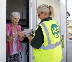 CTM delivering clients meal to the door
