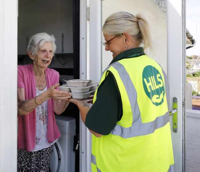 CTM delivering clients meal to the door