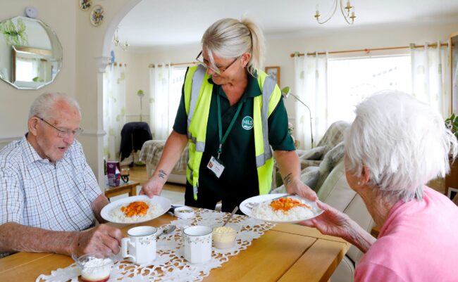 Driver bringing clients meals to them